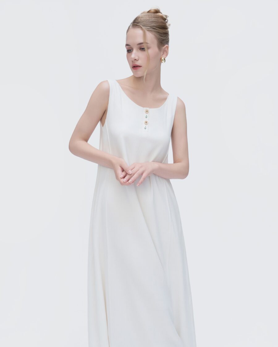 Vintage-inspired white dress with a chic boat neck and soft lining