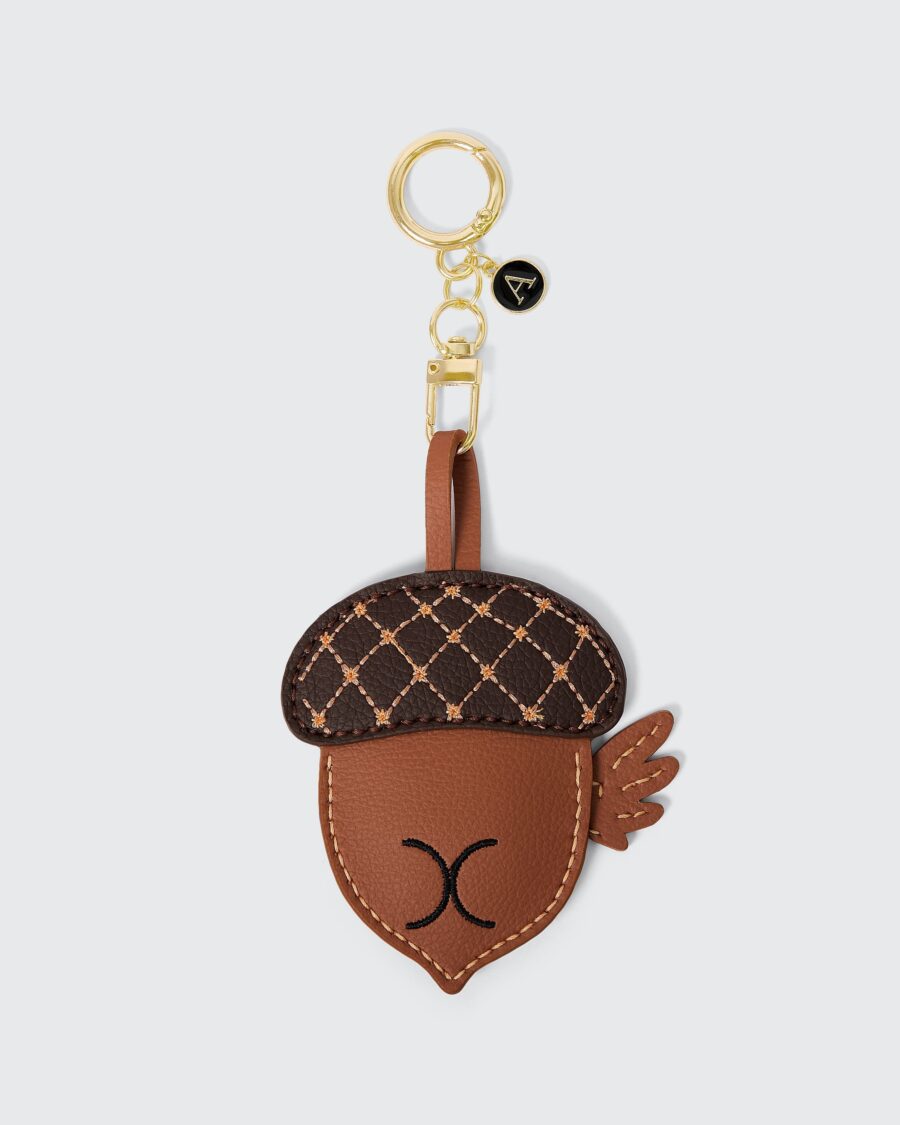 Handmade vegan leather keychain featuring a quirky acorn design